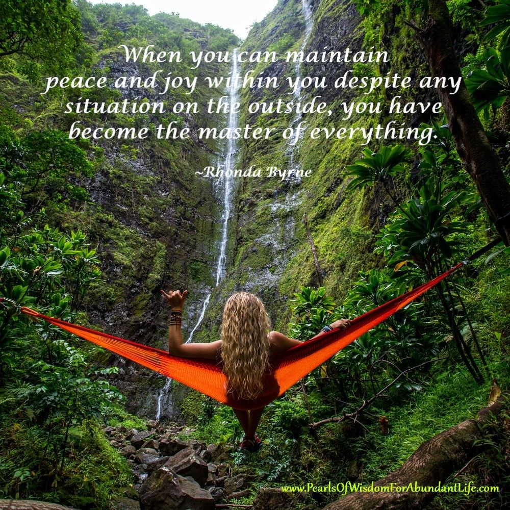 Photo of Woman in Hammock Facing Waterfall